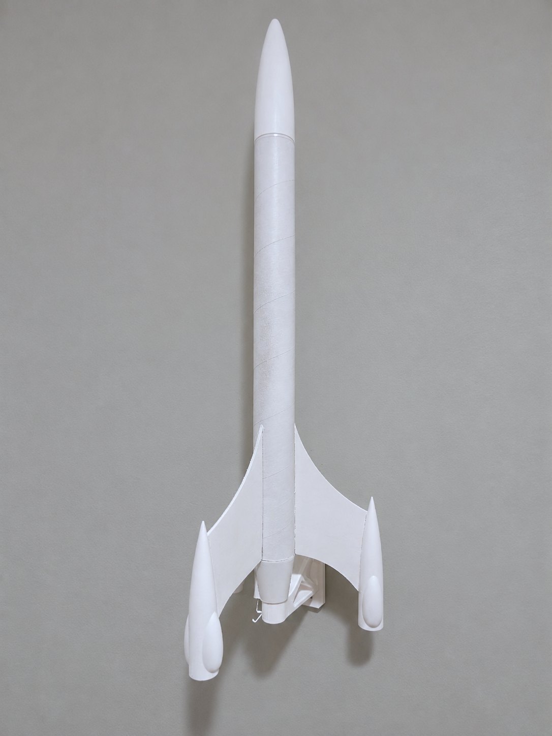 A model rocket displayed on an ITERA wall bracket